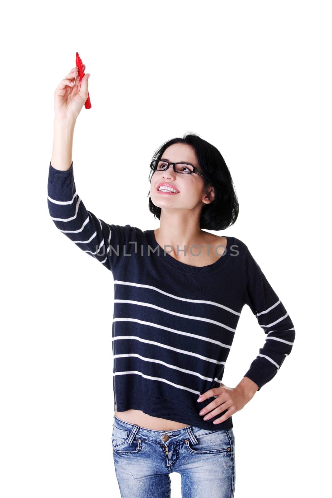 Young student woman writing something on abstract screen with red marker