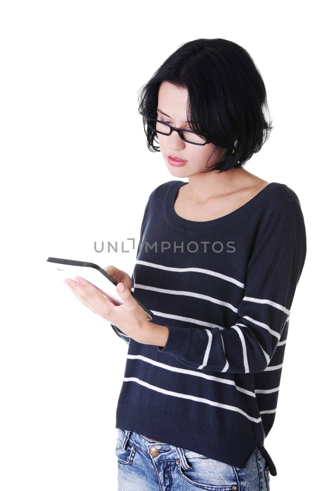 Young pretty woman working on tablet computer, isolated on white