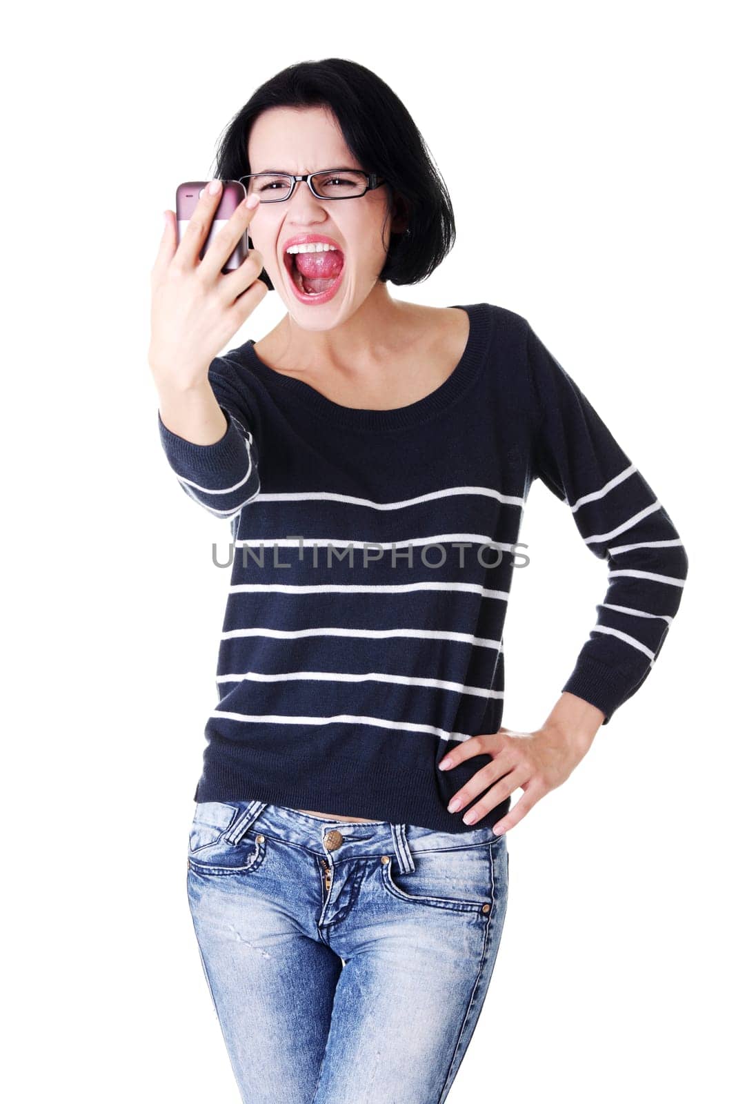 Teen girl using cell phone- yelling angry, isolated on white