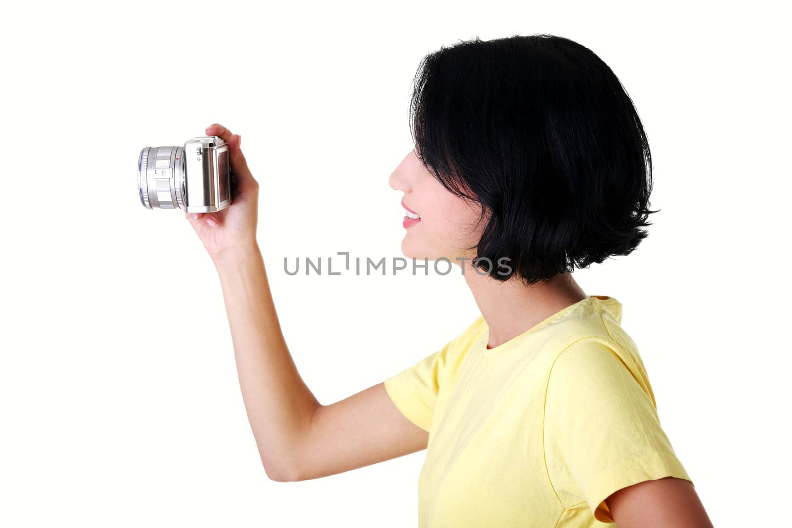 Close-up of a young woman photographer doing photo