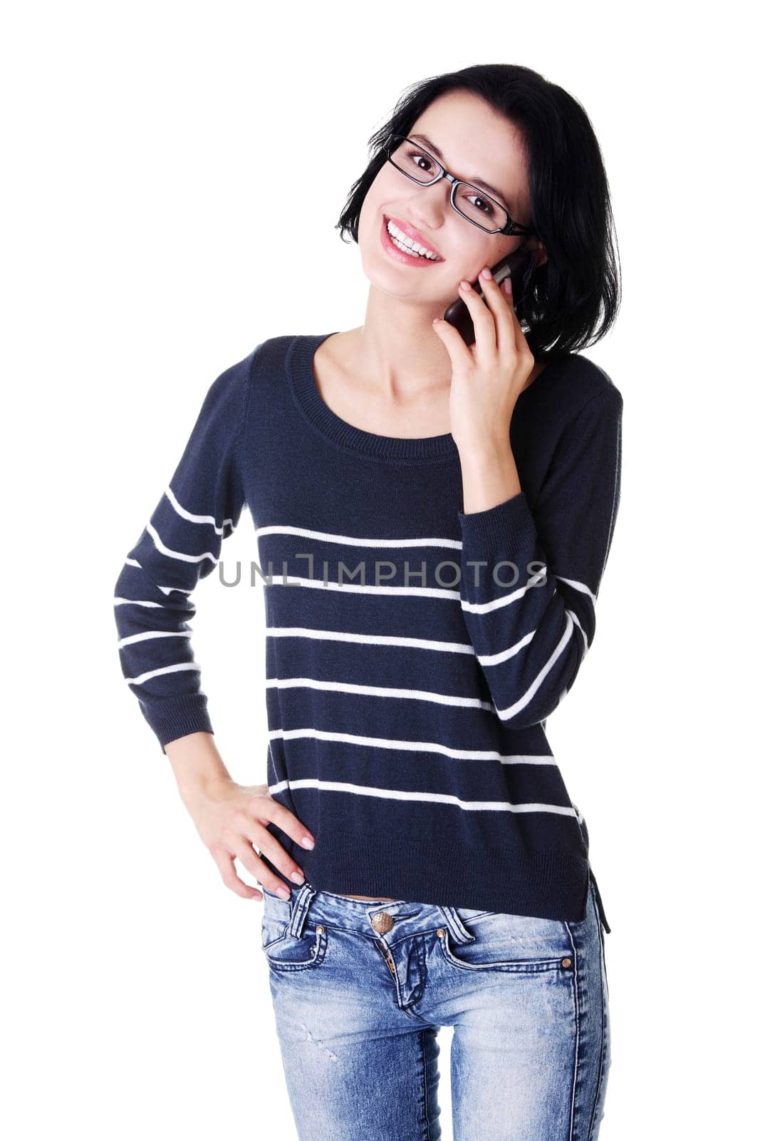 Young happy caucasian woman is calling with a mobile phone (smartphone) isolated on white