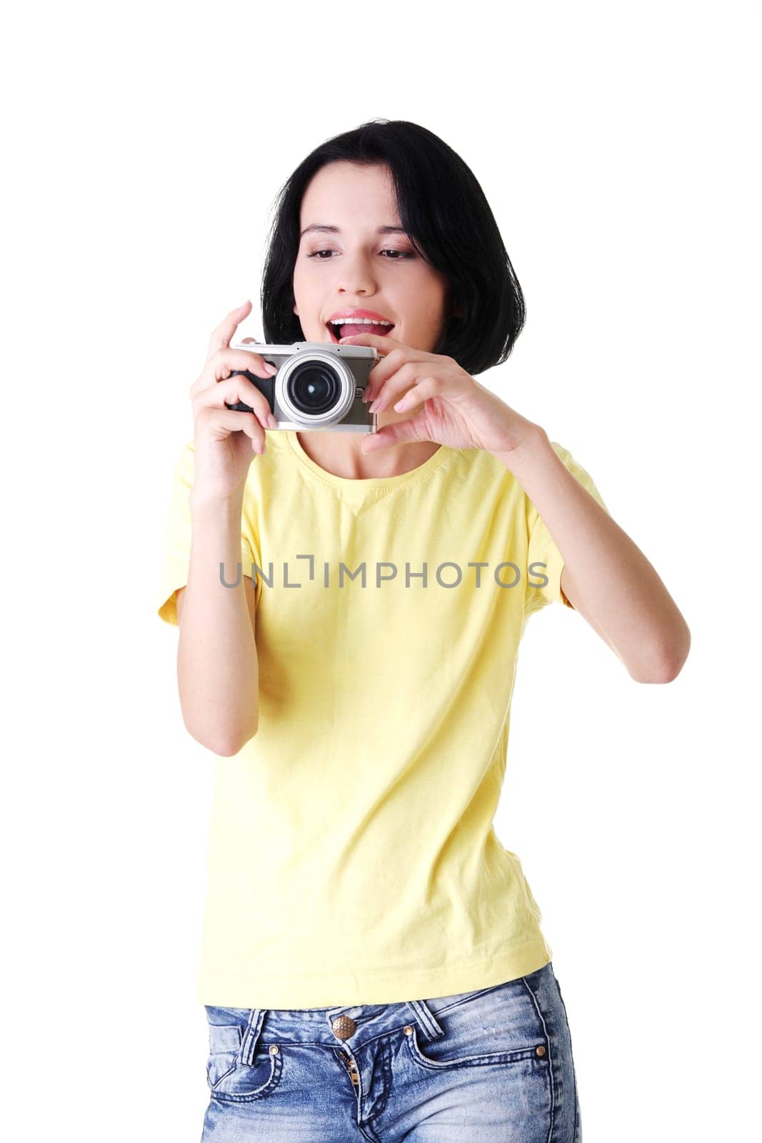 Close-up of a young woman photographer doing photo