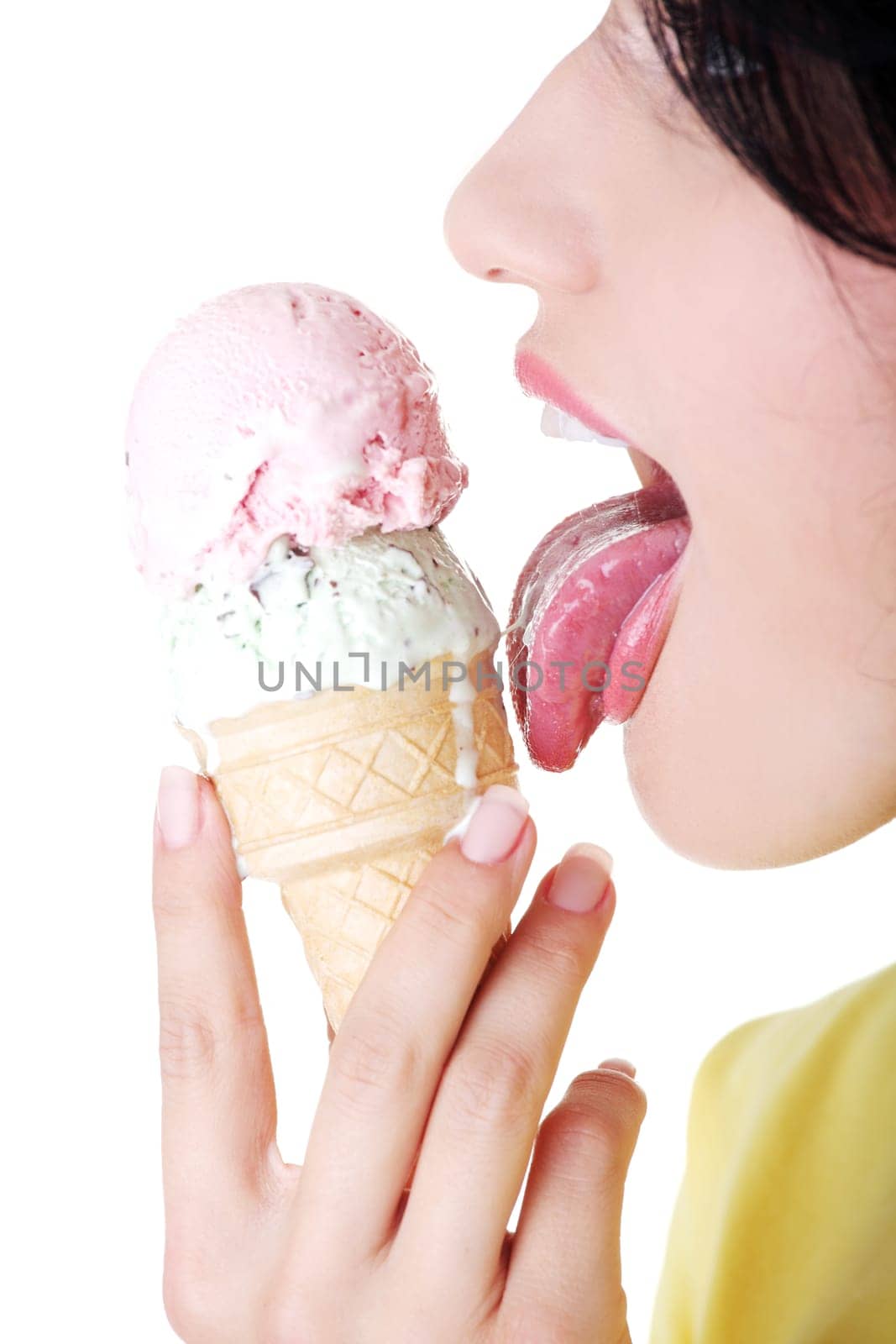 Young woman eating ice cream, isolated on white