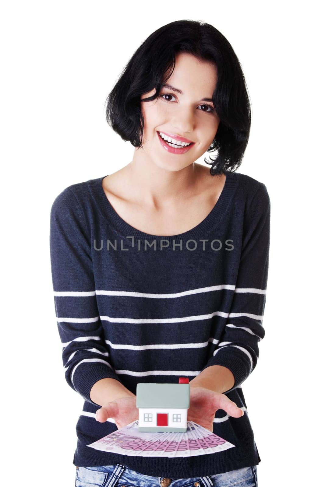 Happy woman holding euros bills and house model over white - real estate loan concept