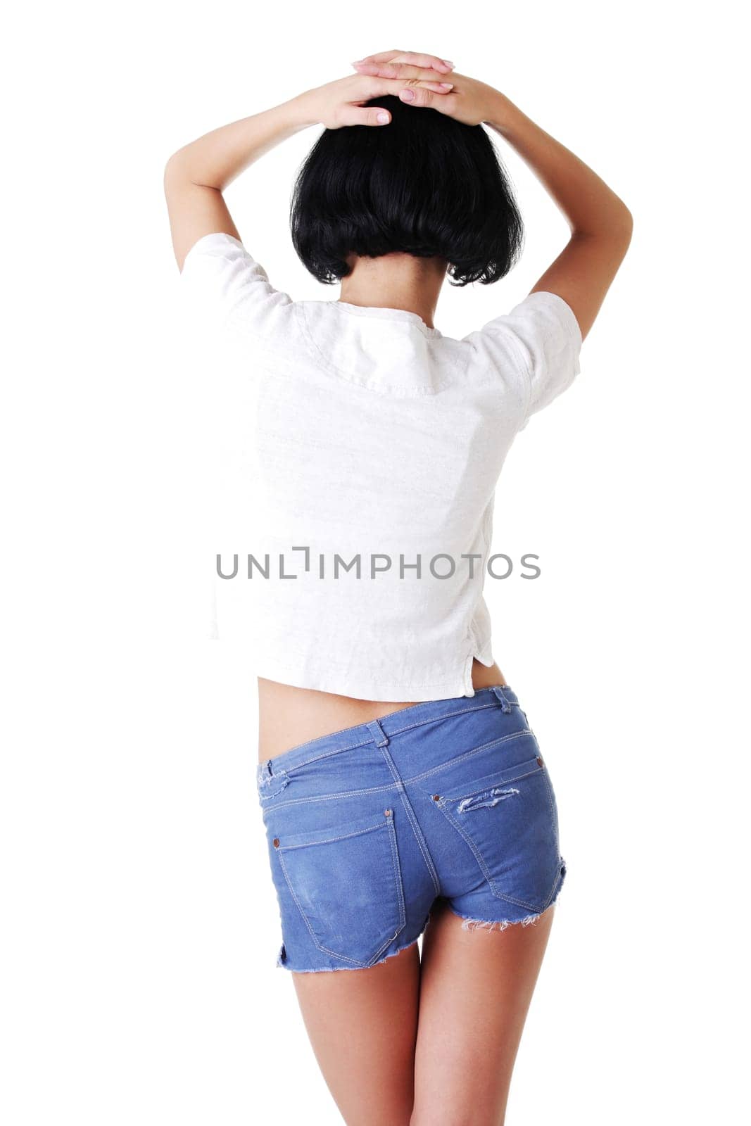 Fit woman in jeans shorts isolated on white