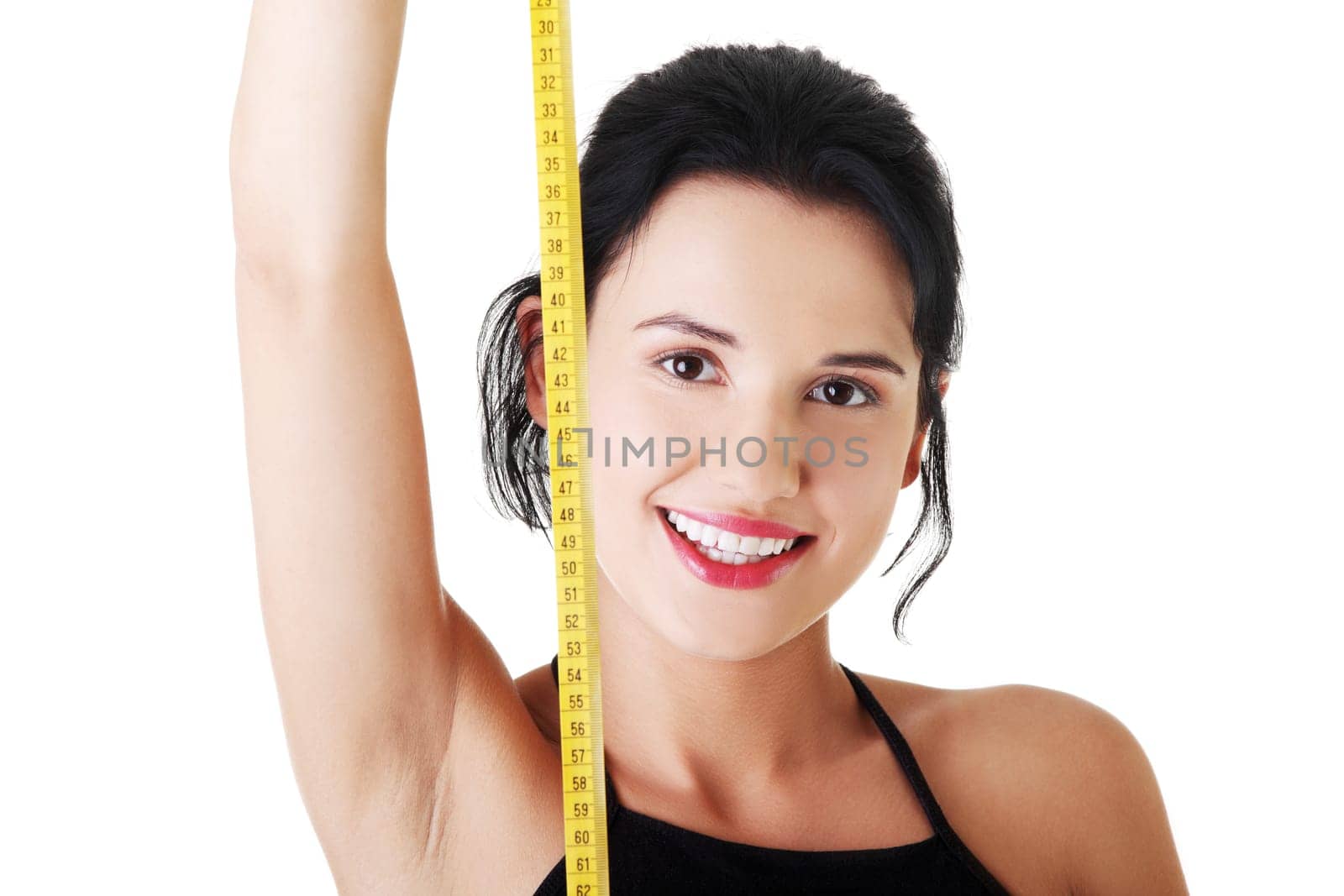 Pretty smiling woman holding measurement type - isolated on white