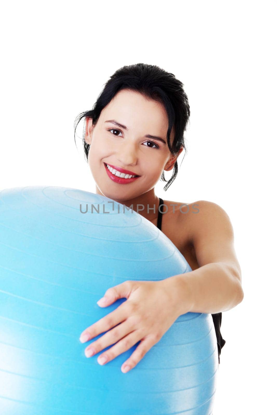 Beautiful young healthy lifestyle woman with pilates exercise ball.