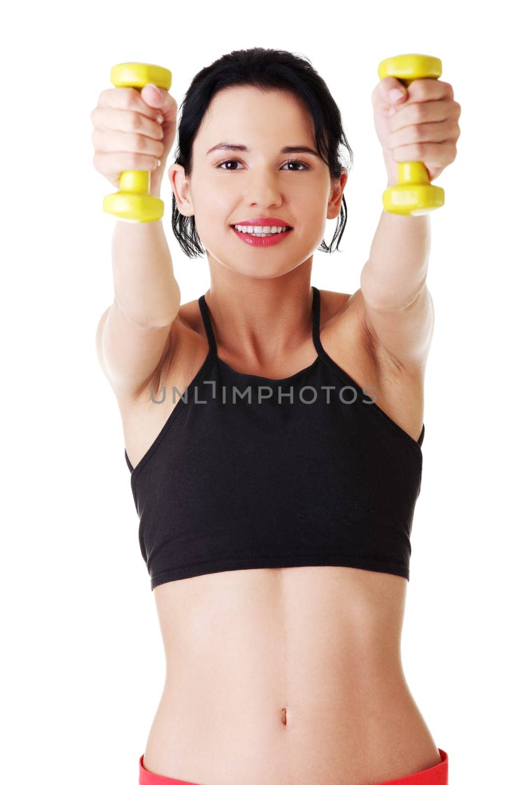 Fitness girl is working out with dumbbells , isolated on white background