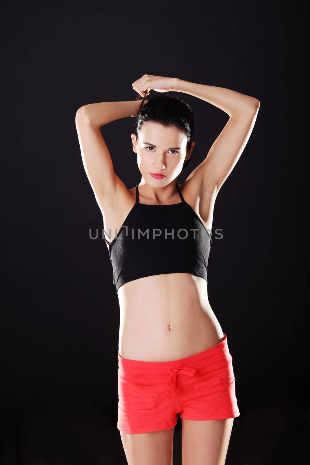 Attractive fitness woman in sport clothes