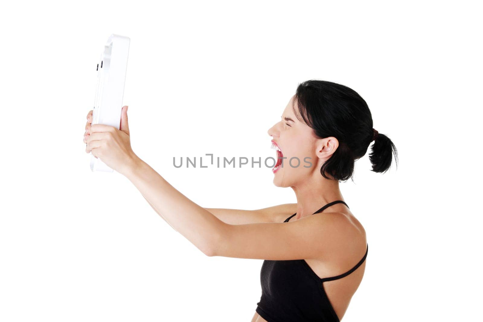 Frustrated woman with scale, isolated on white