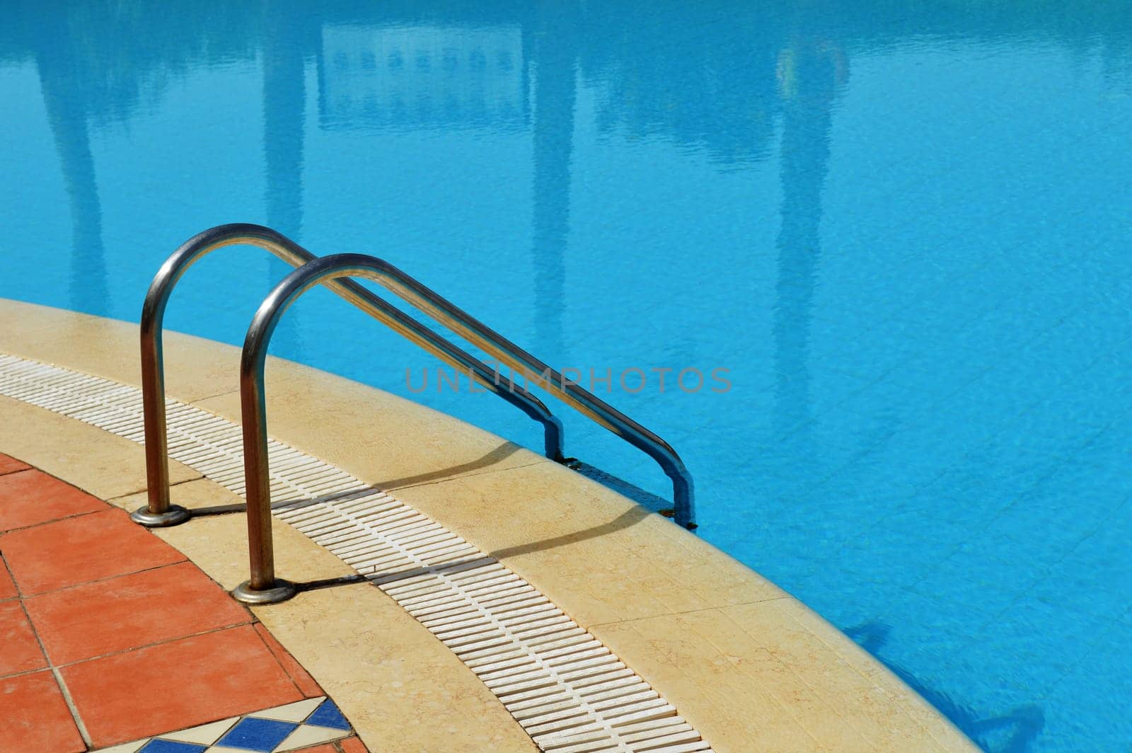 Swimming pool in touristic resort during summer time