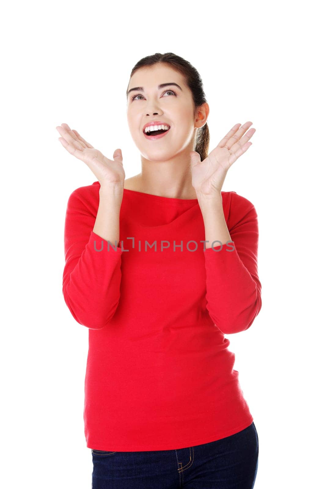 Shocked woman looking up, isolated on white