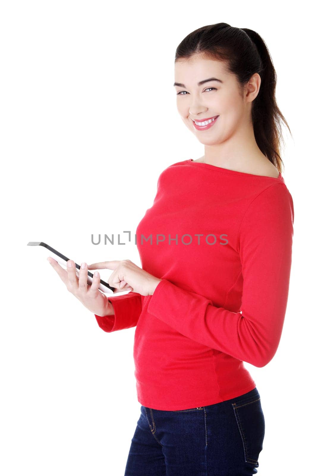 Beautiful happy young caucasian woman using tablet computer , isolated on white
