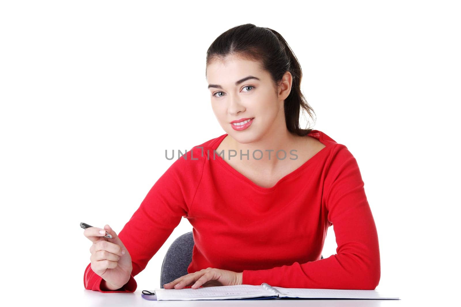 Adult student woman learnig at the desk, isolated on white background