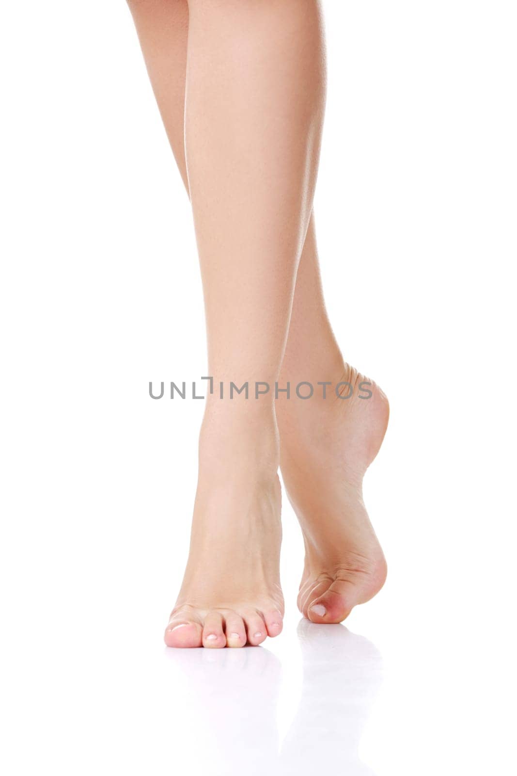 Beautiful fit long female legs, isolated on white