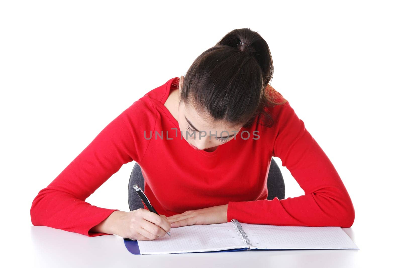 Adult student woman learnig at the desk, isolated on white background