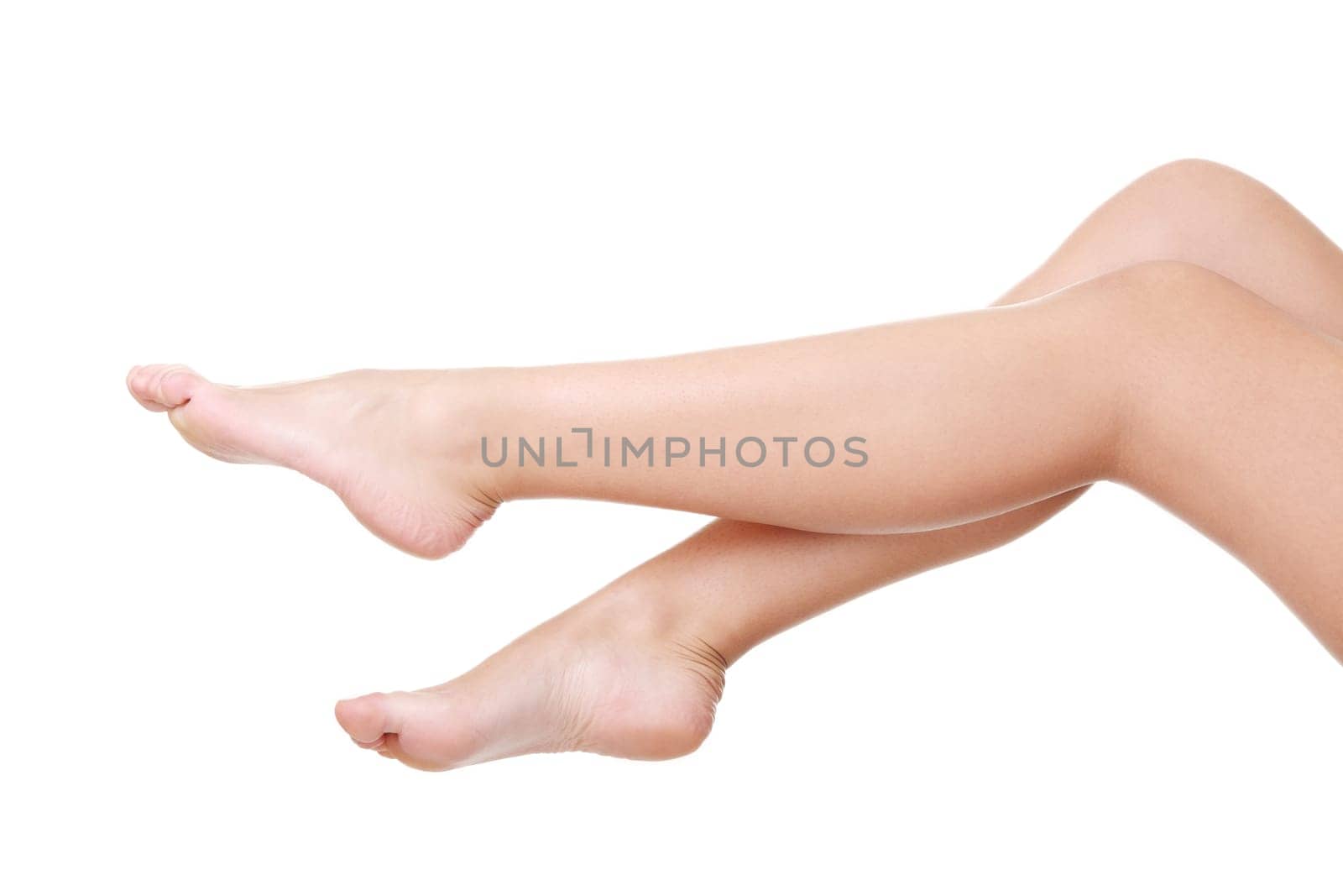 Beautiful fit long female legs, isolated on white