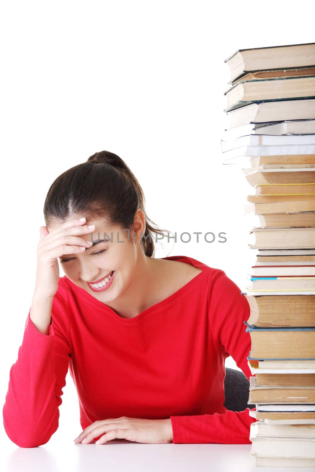 Happy smiling young student woman with books, isolated on white background