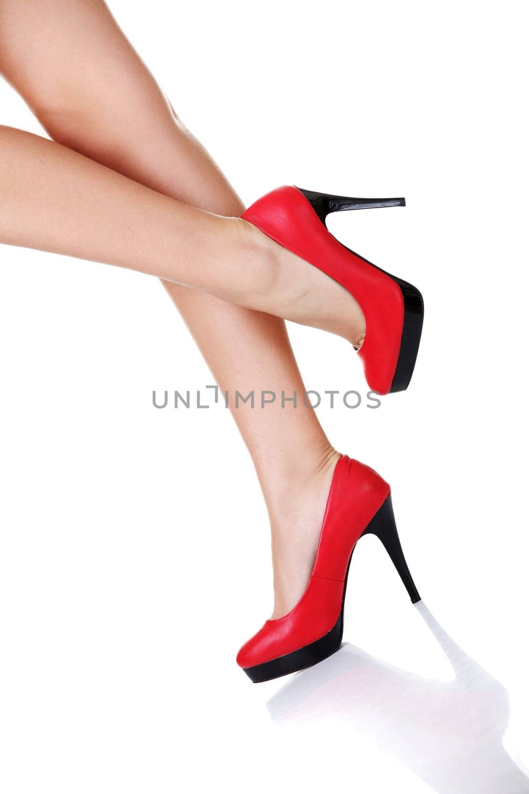 Woman's leg and high heel shoes ,isolated on white