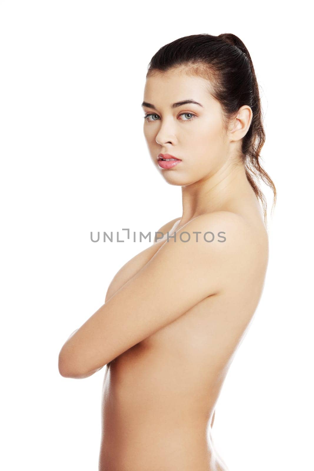Beautiful fit sensual topless woman, isolated on white