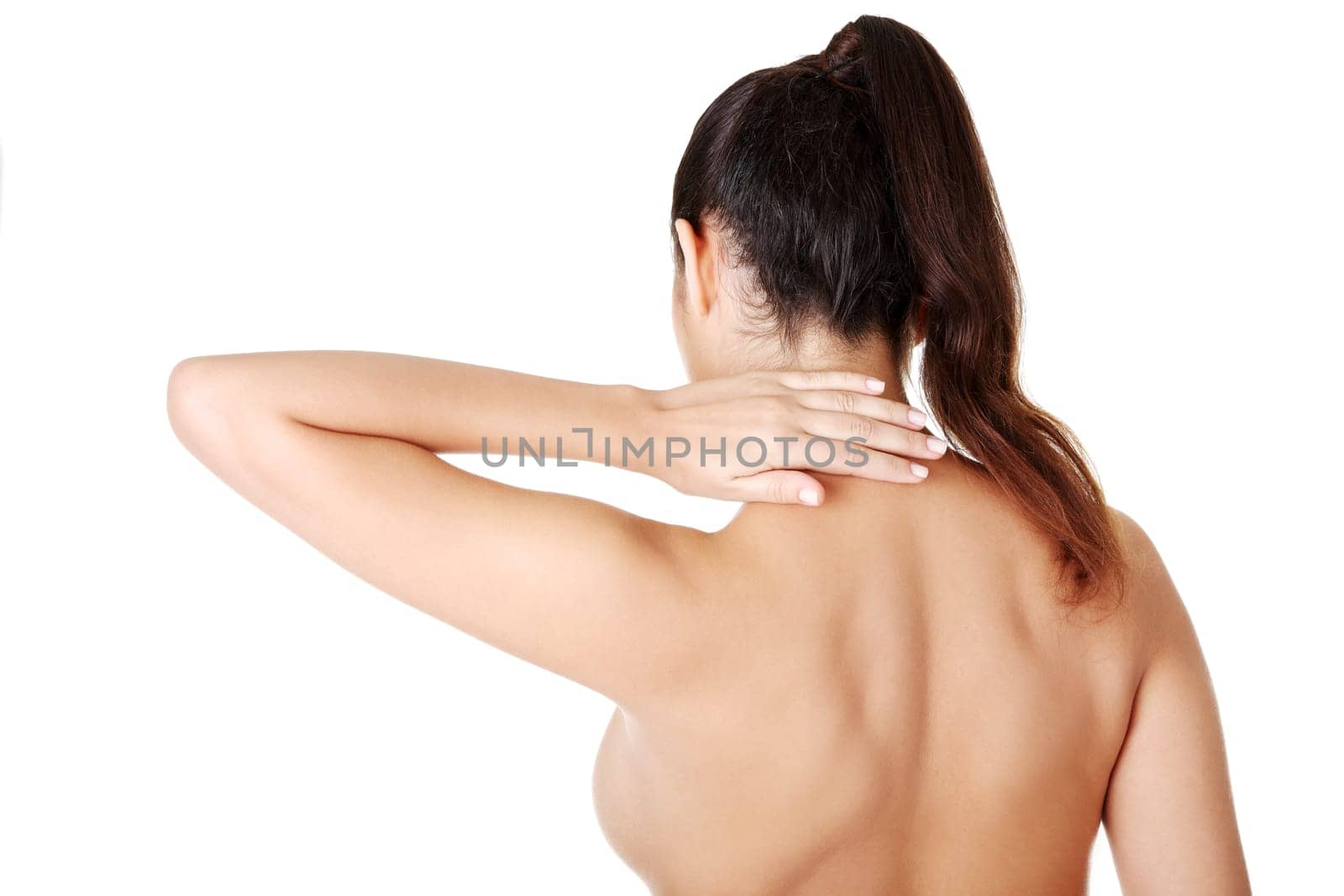 Young woman with pain in her back. Isolated on white