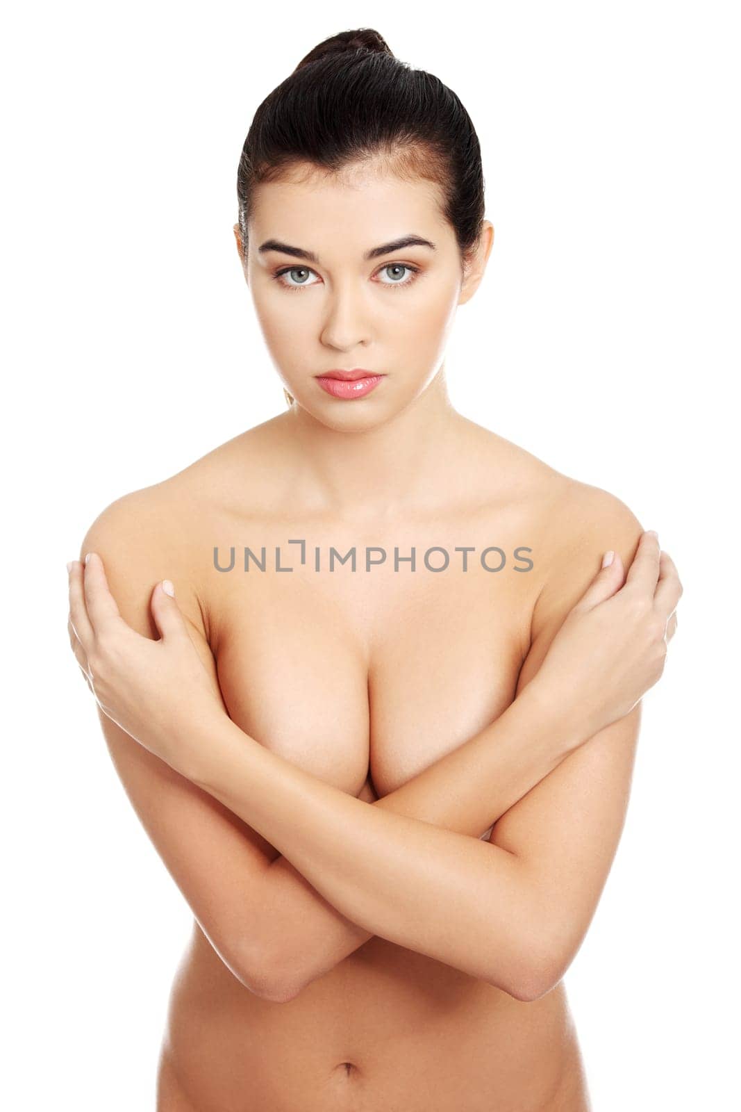 Beautiful fit sensual topless woman, isolated on white