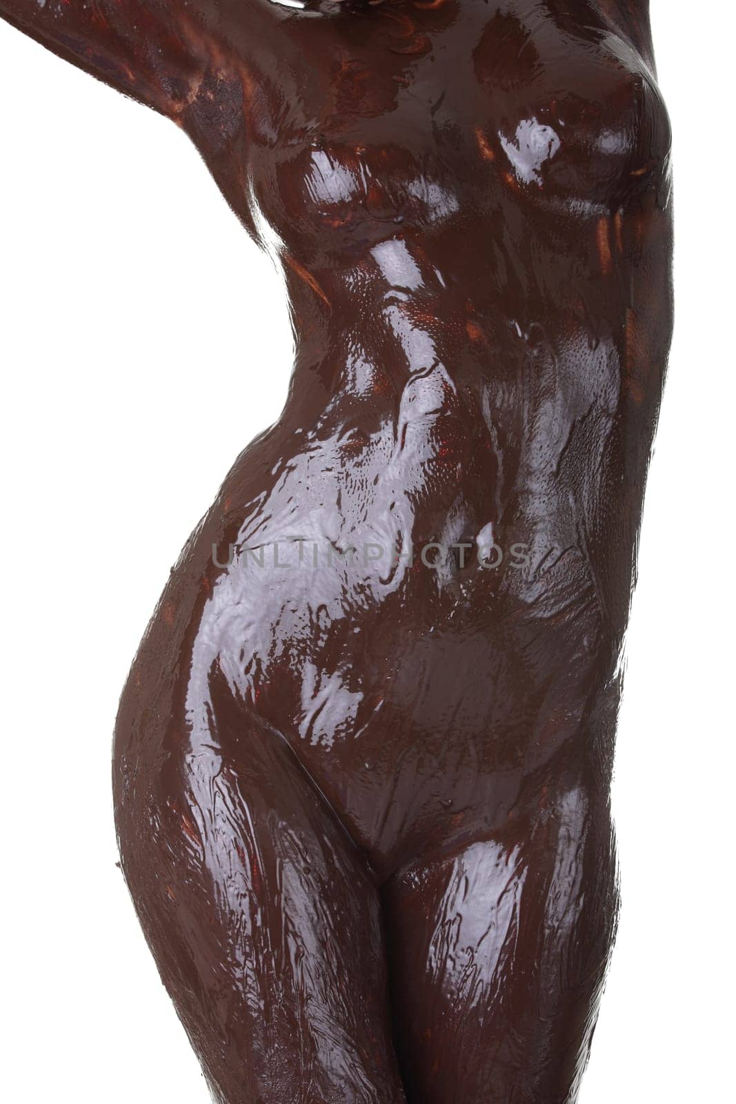 Naked female body covered with chocolate, isolated on white