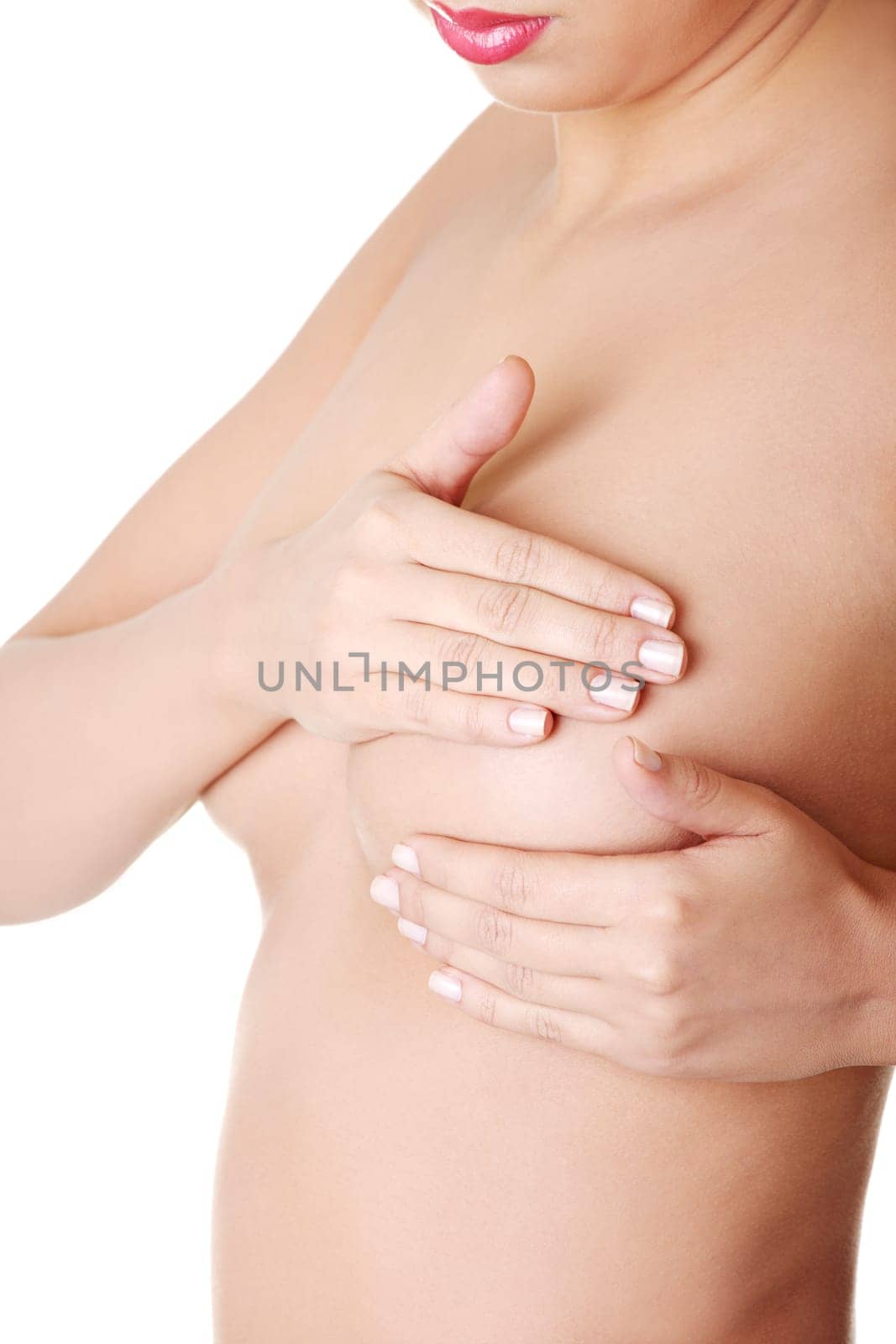Woman examining breast mastopathy or cancer. Isolated on white