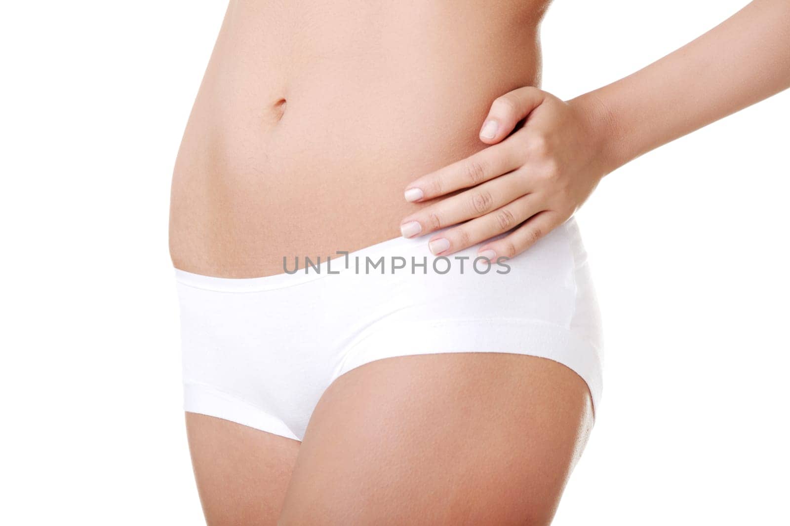 Beautiful female body isolated on white. Sexy young woman in white panties