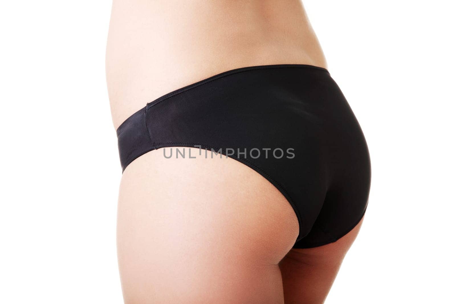 Slim tanned woman's body. Isolated over white background.