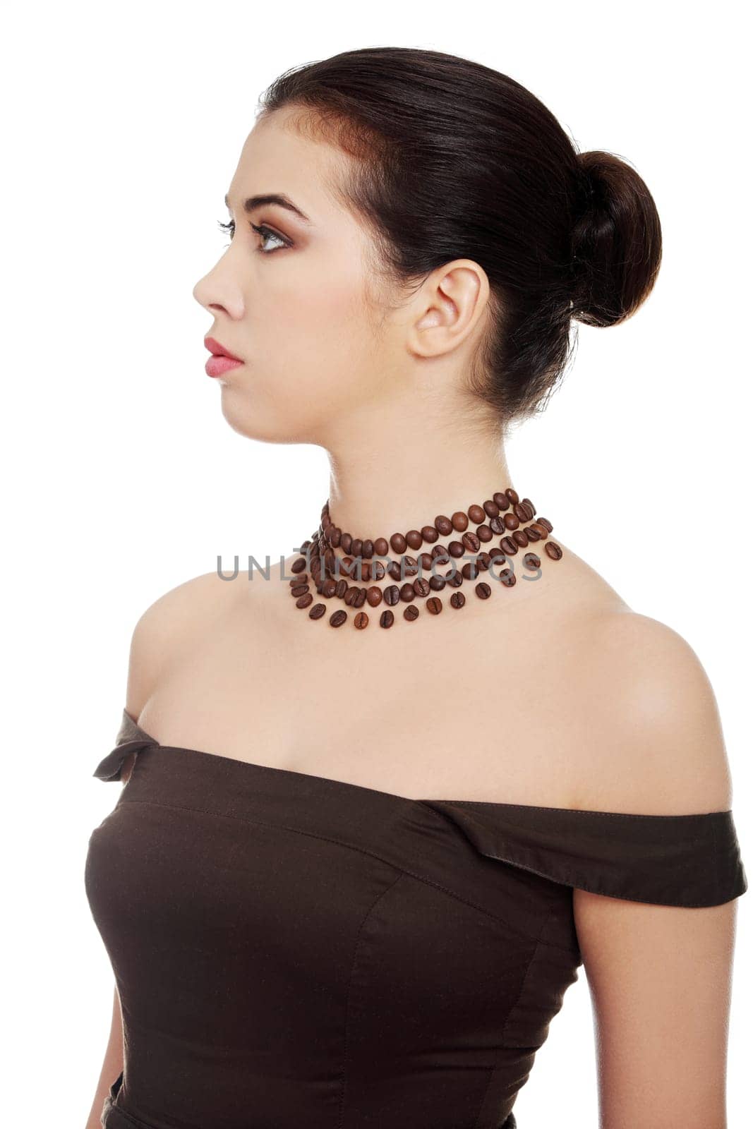 Beautiful elegant young woman with necklace made frome coffee beans, isolated on white