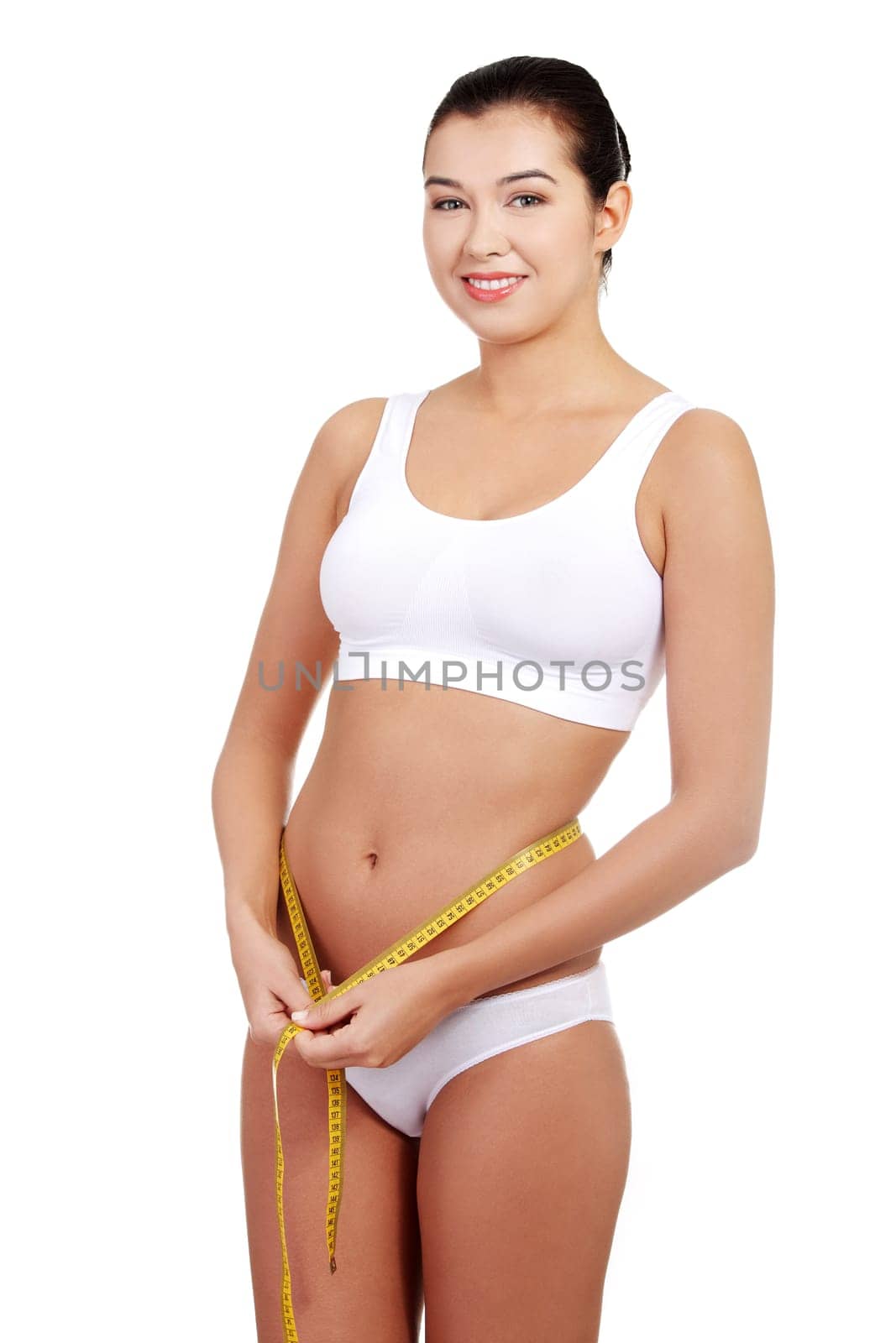 Pretty smiling woman with measurement type - isolated on white