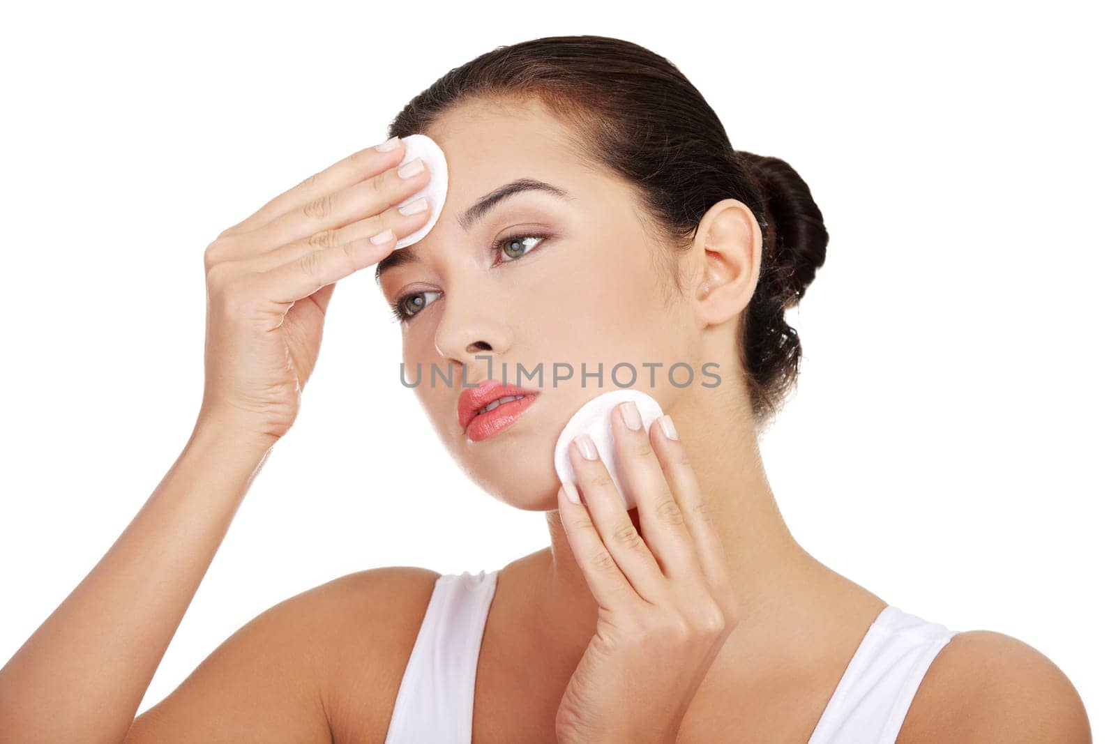Beautiful woman with cotton pad , isolated on white