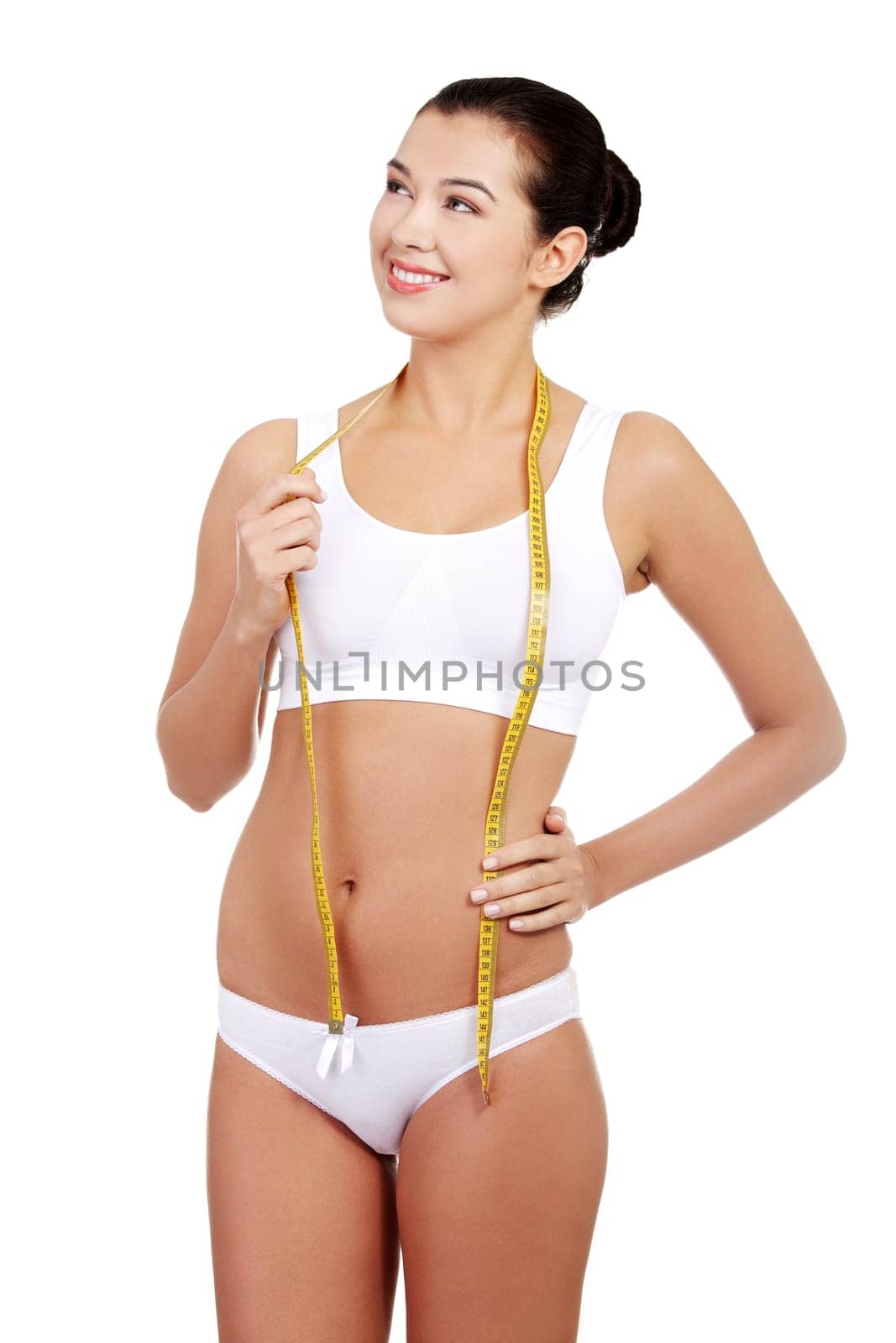 Pretty smiling woman with measurement type - isolated on white