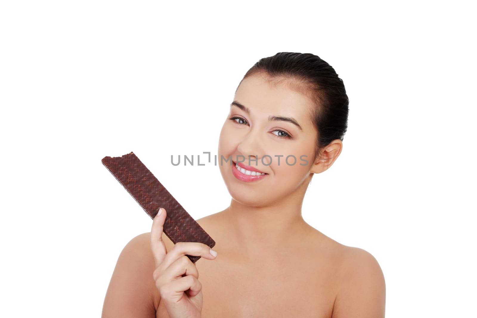 Pretty happy smiling woman eating chocolate waffle, isolated on white