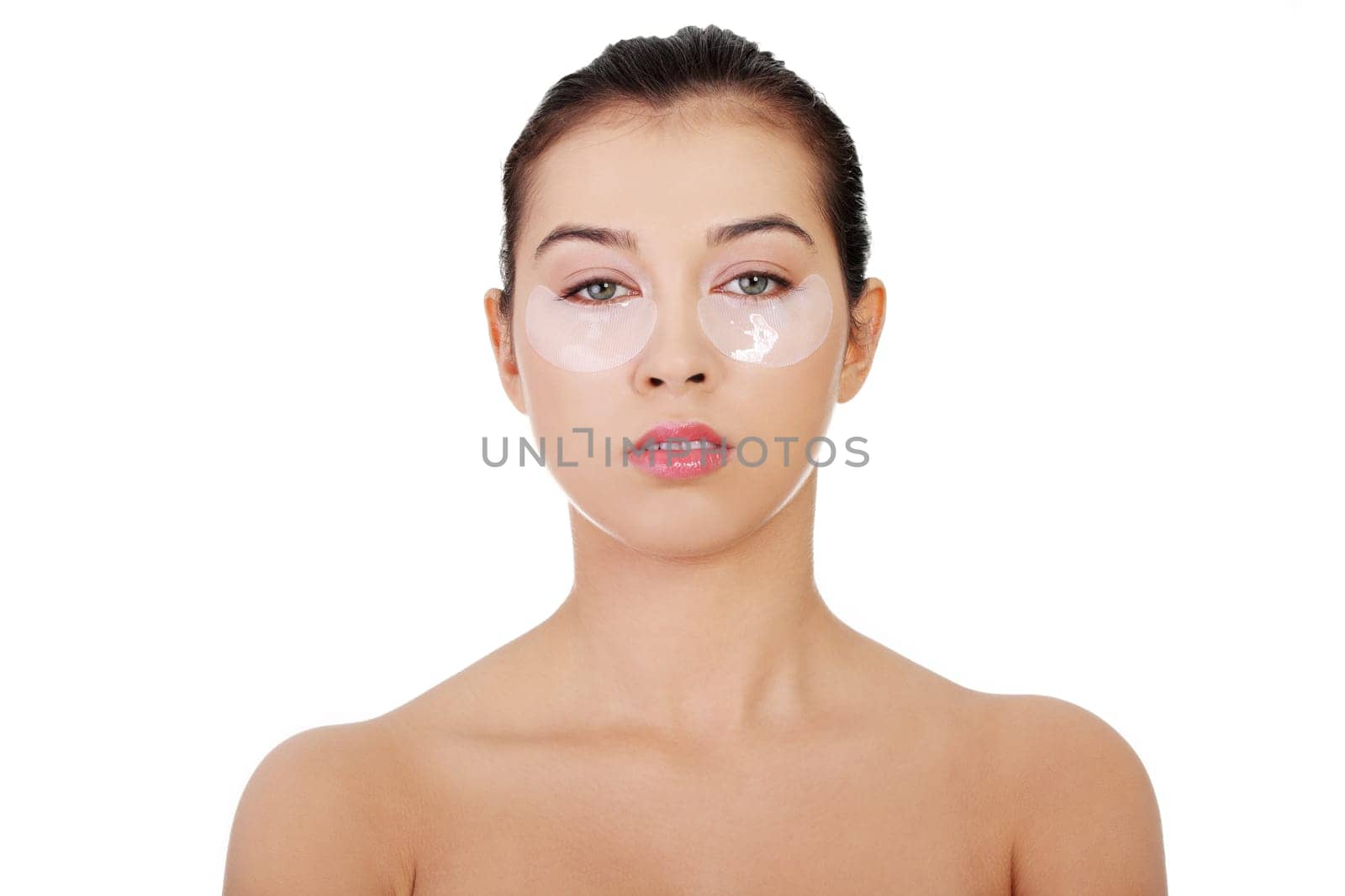 Young beautiful woman with collagen eye lift mask, isolated on white.