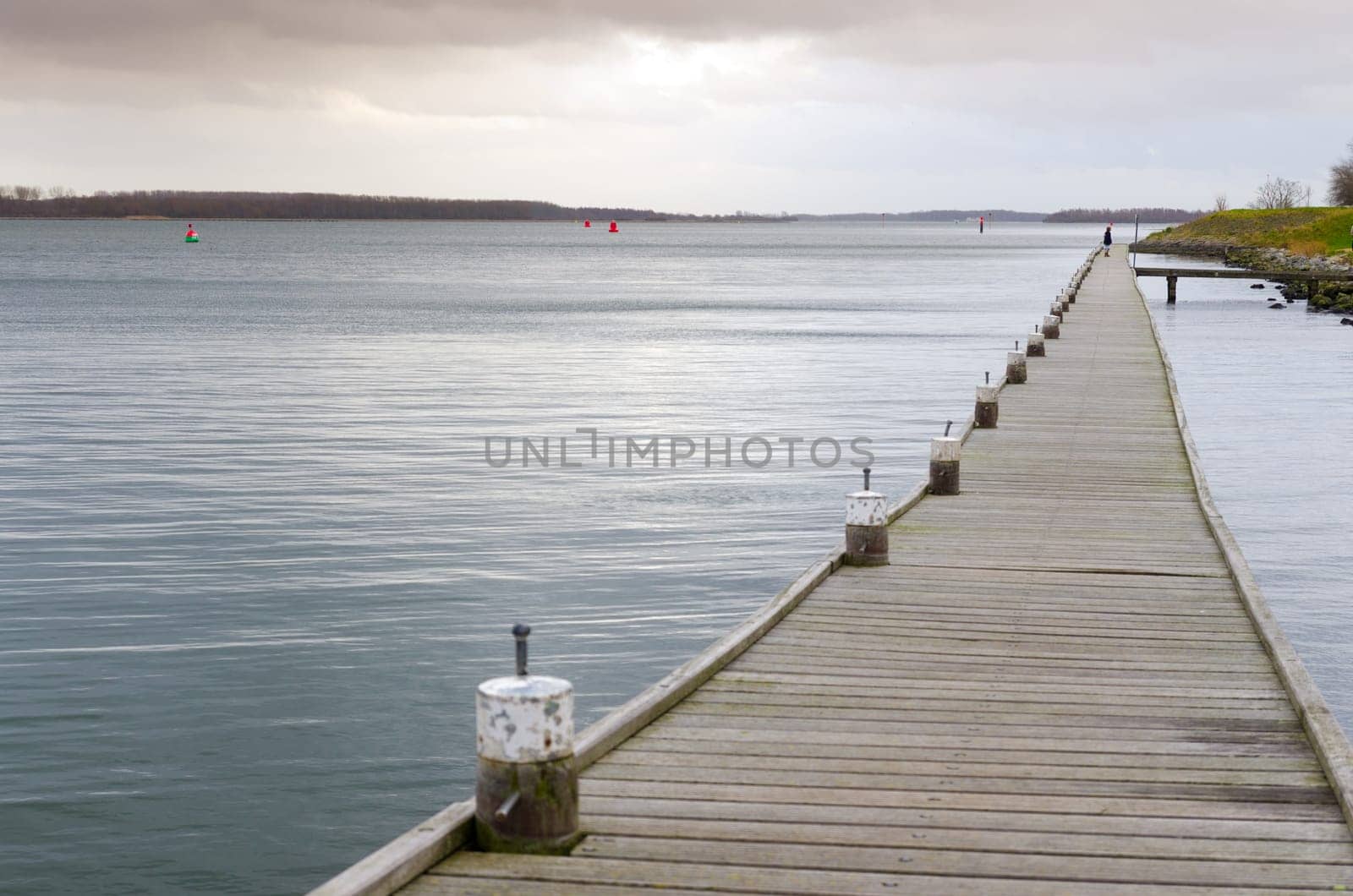 long wooden pier at the "Veerse meer"" in the Netherlands"