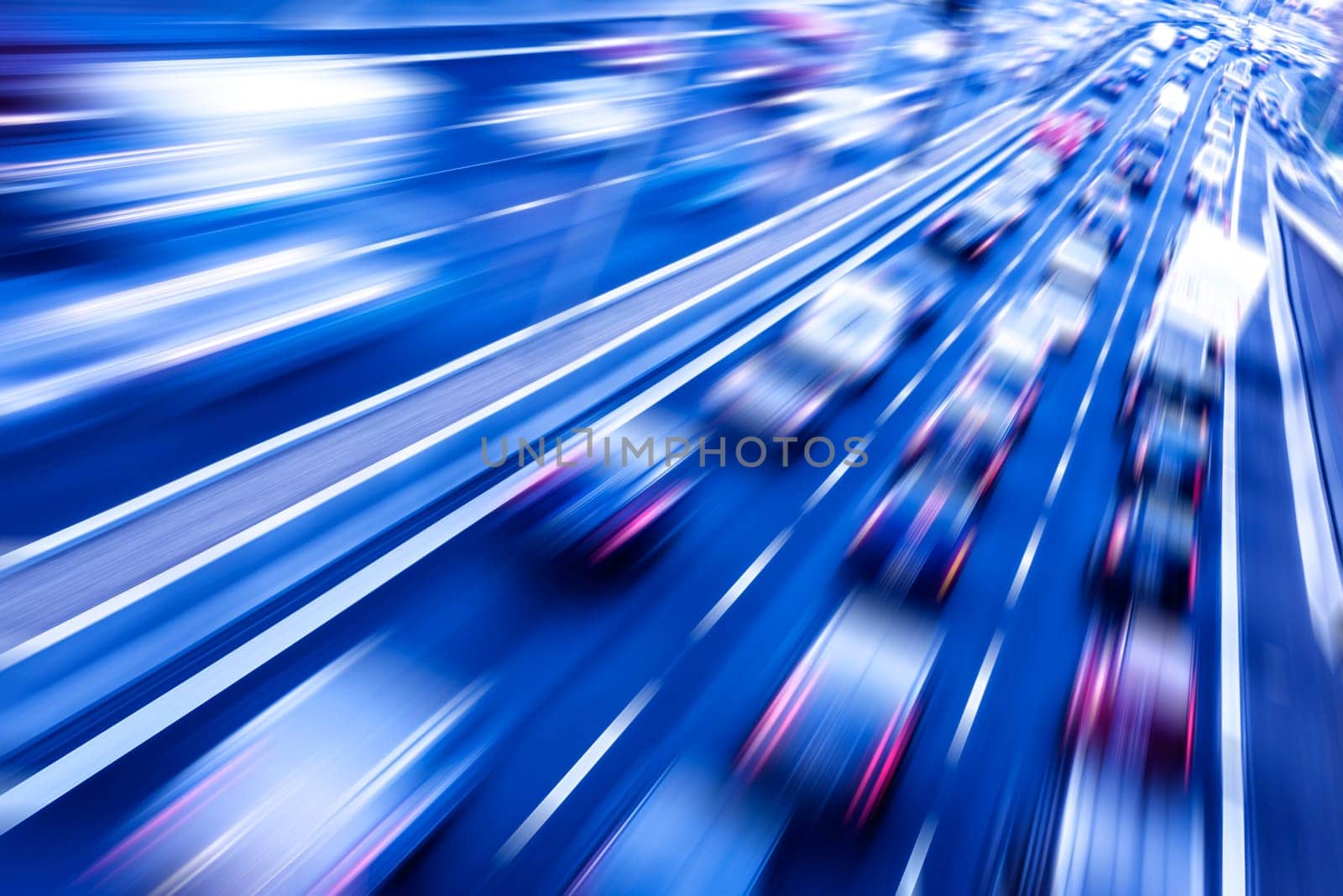 traffic on a freeway with blurred cars in evening