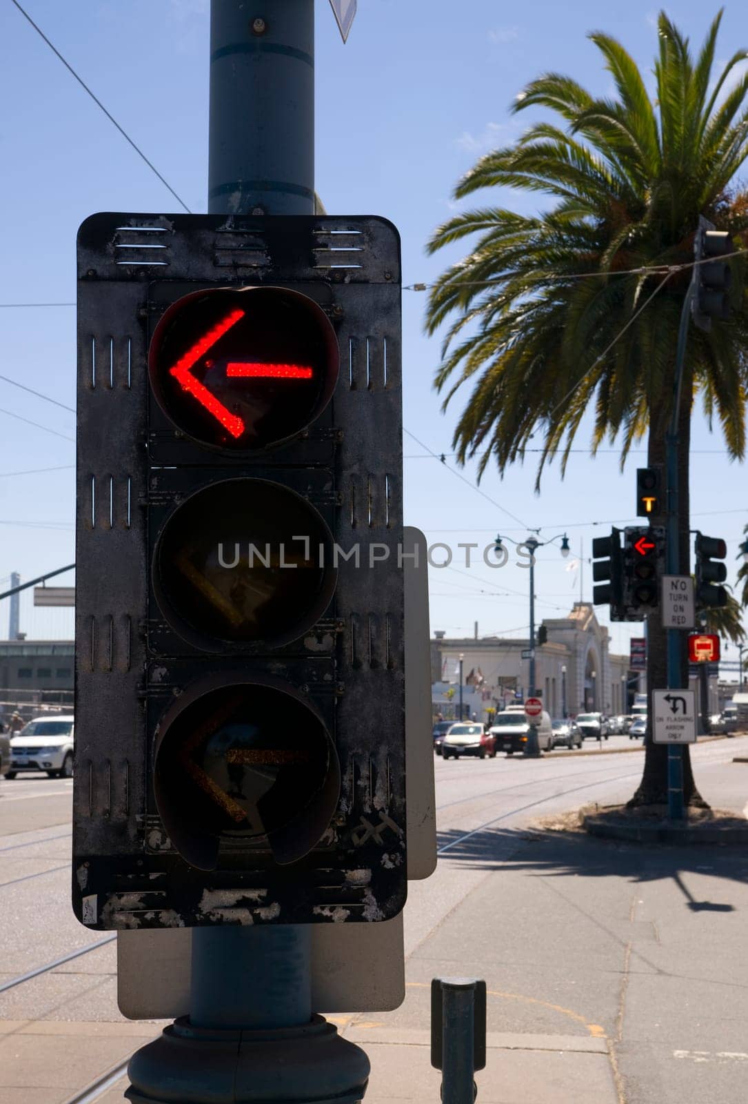 3-Way Left Turn Signal Street Traffic Controller Device Downtown City Corner Currently Showing Red Arrow