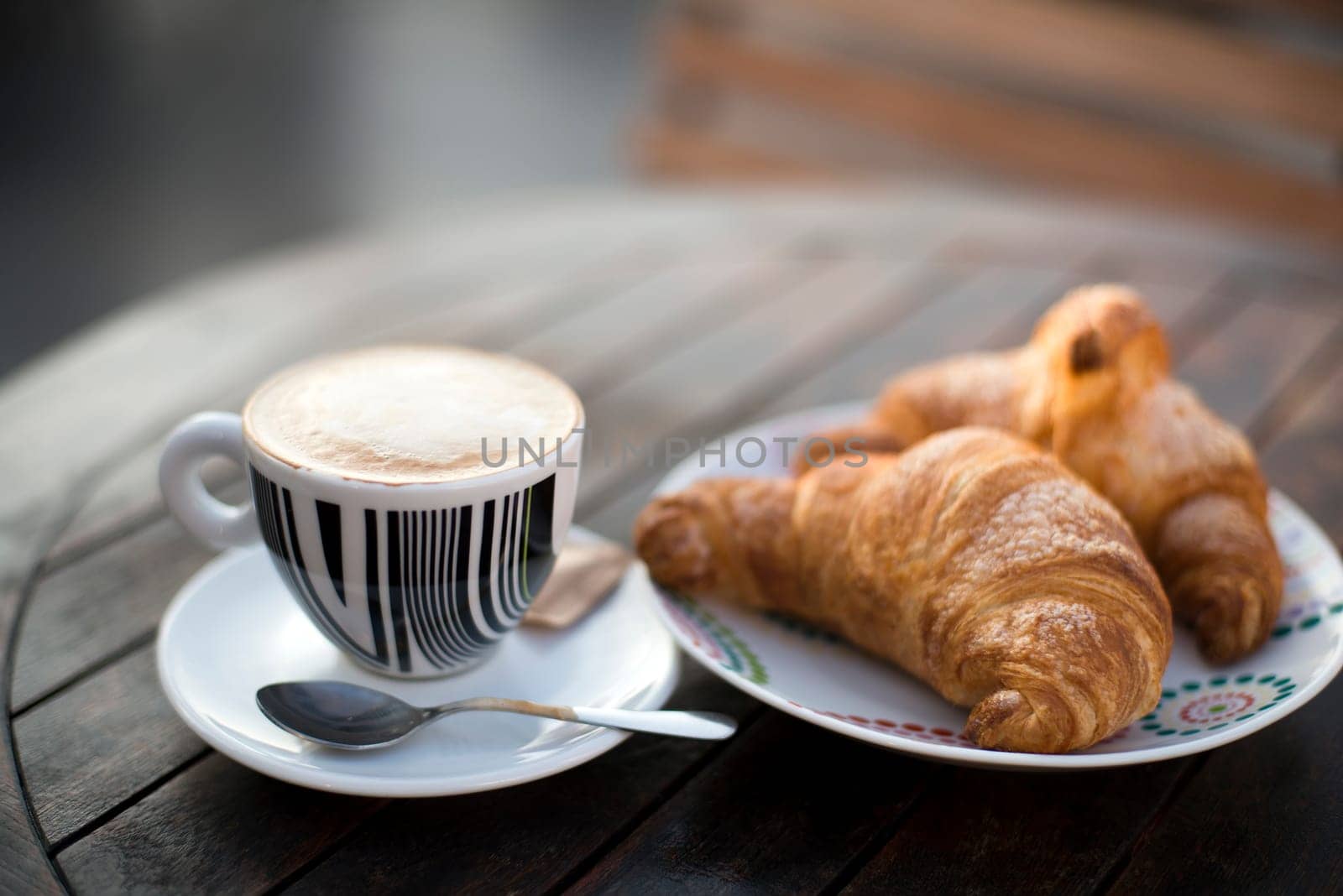 Fresh Cappuccino and croisant close up shoot