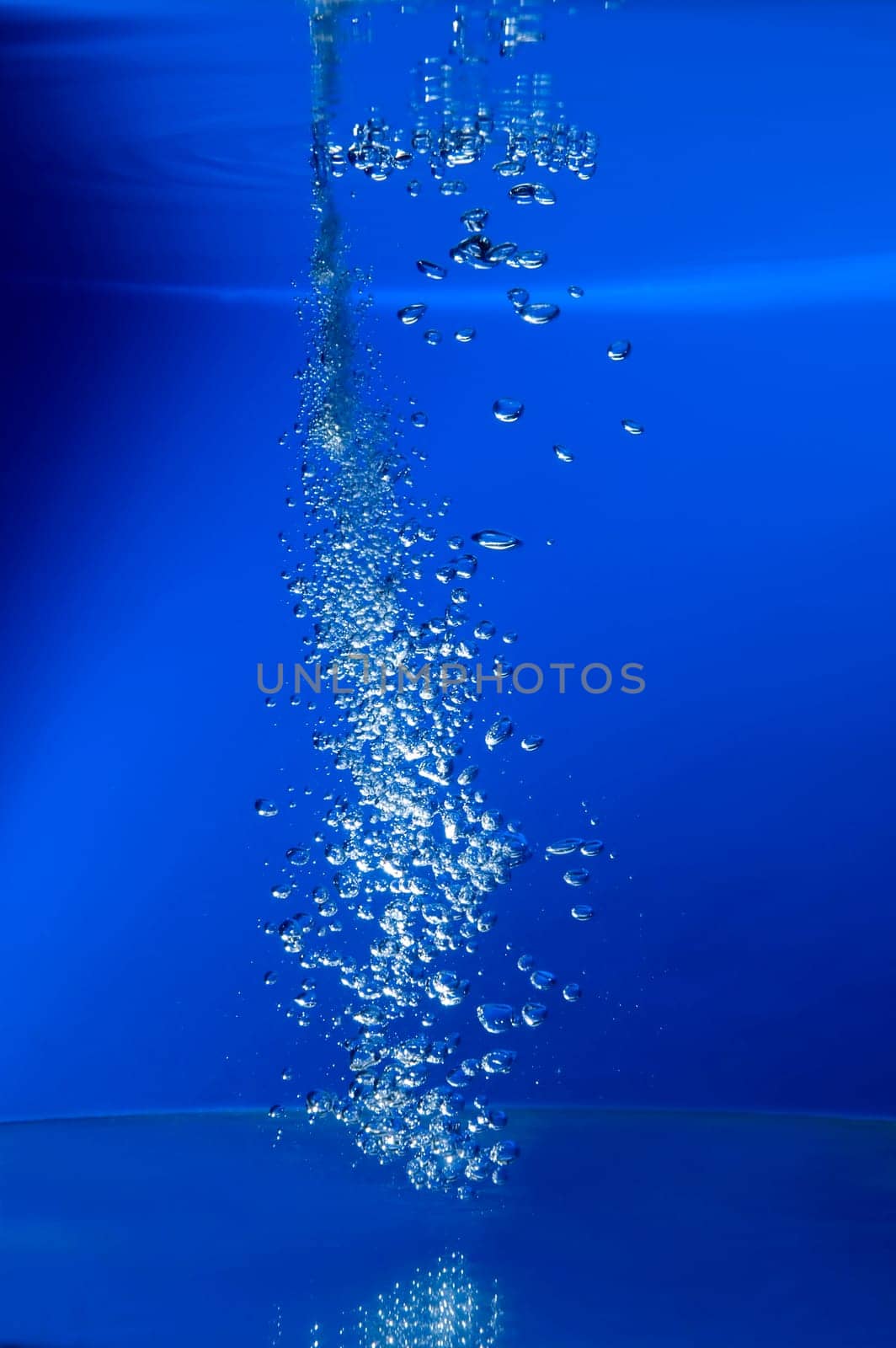 water bubbles on blue background close up