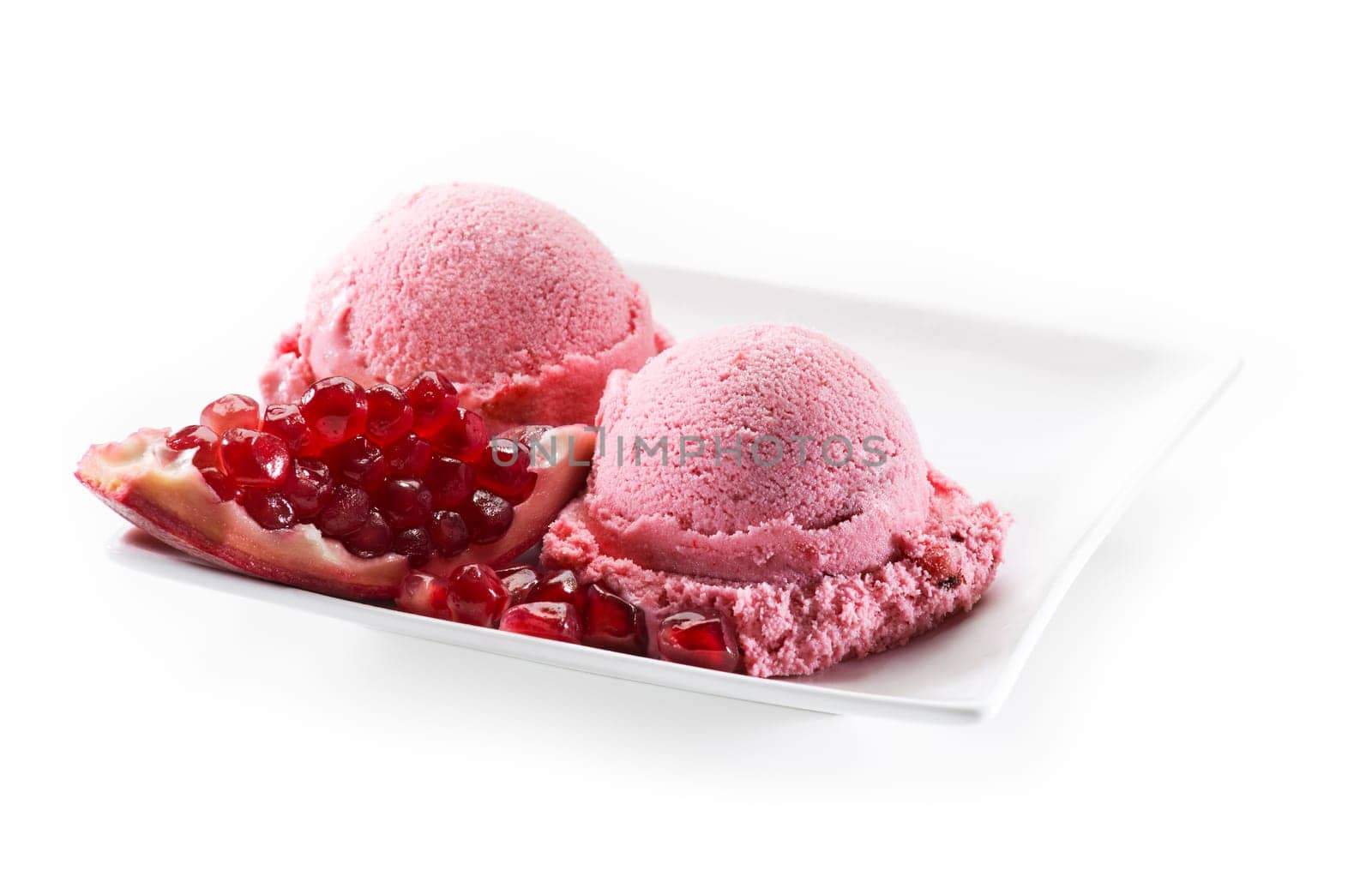 Fresh pomegranate ice cream on white background close up