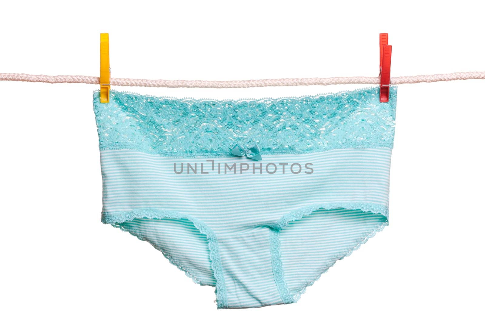 Striped briefs hanging on a clothesline. Isolate on white.
