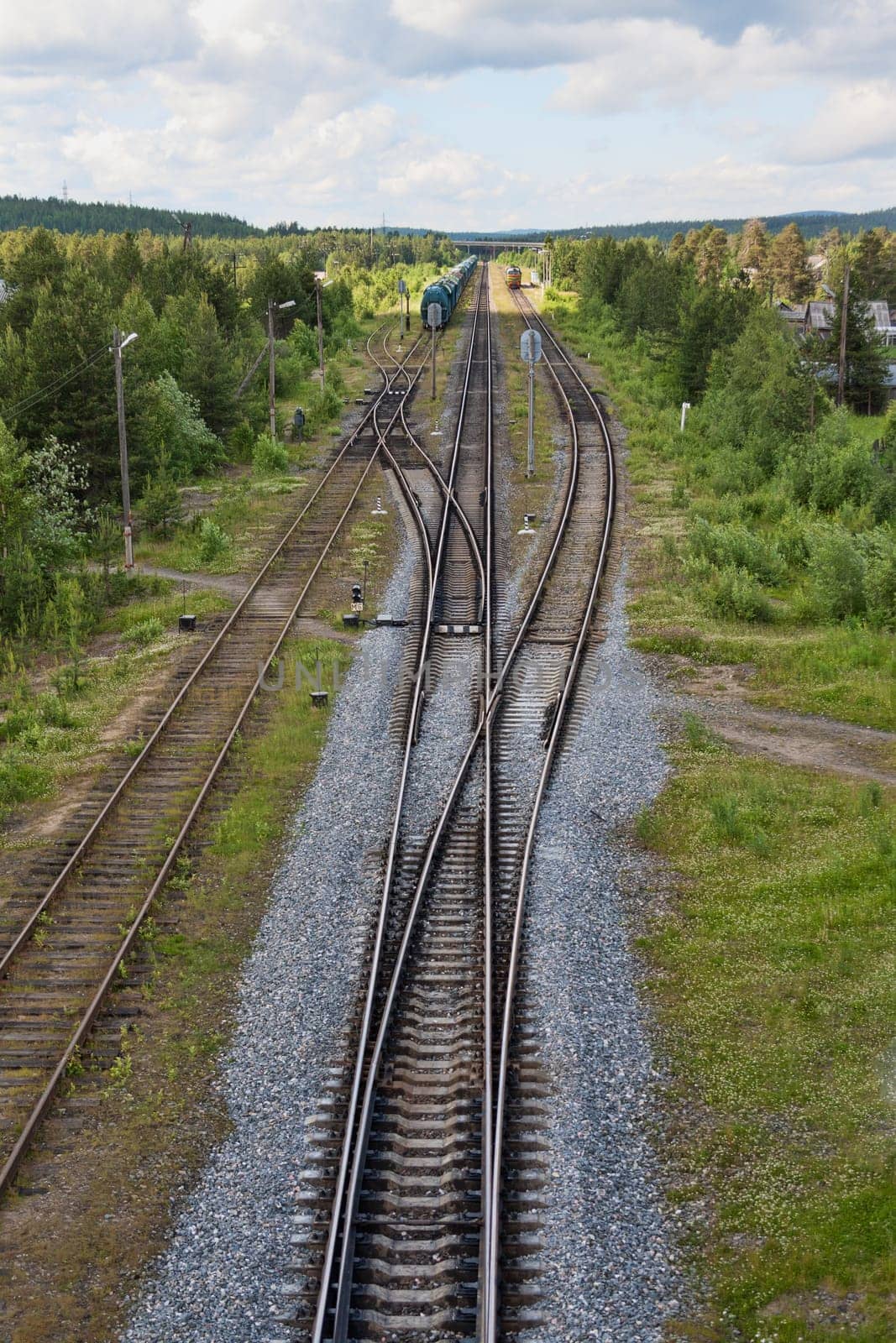 Railroad tracks, isolation and trains on the road against the backdrop of nature