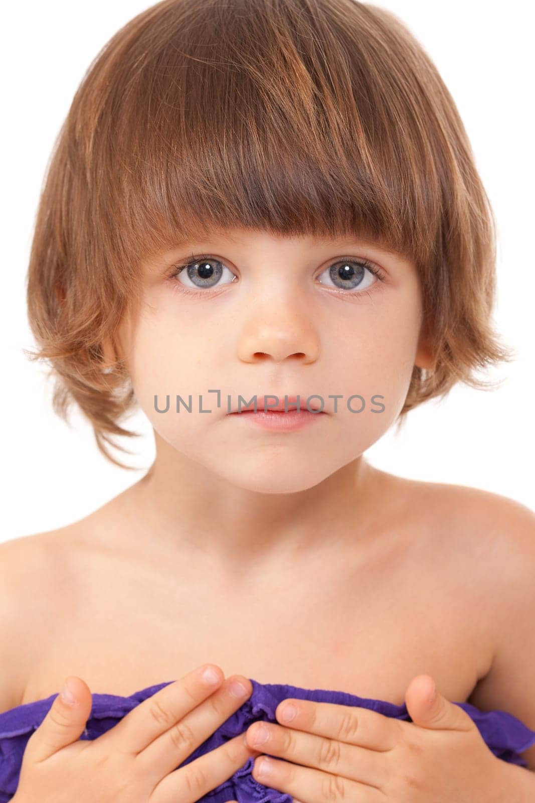 Portrait of a charming young girl close-up in the studio on a white background