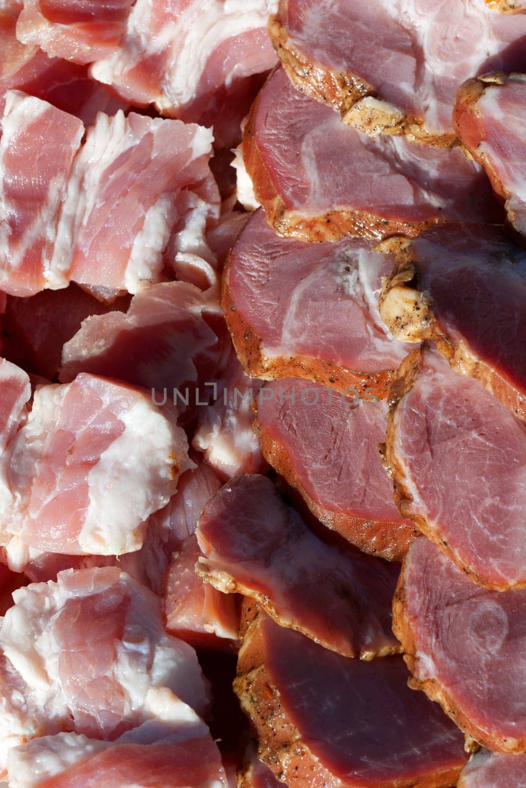 Fresh meats packed in rows, background.