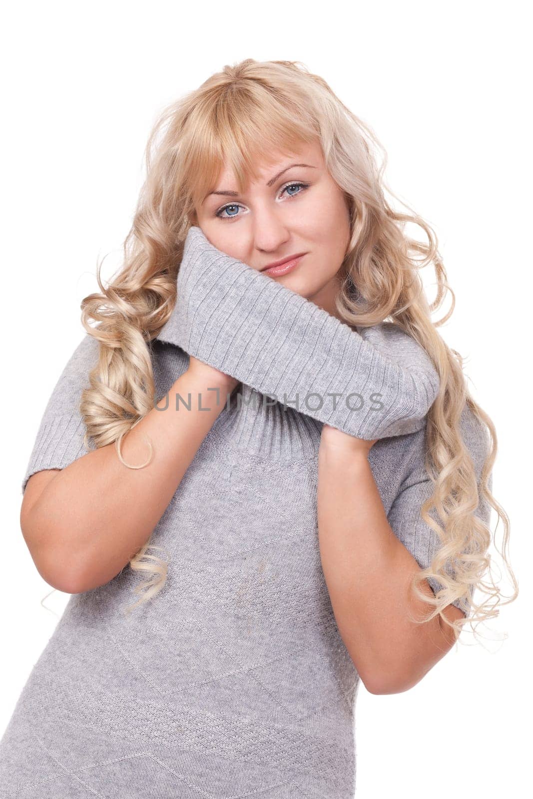 Beautiful winter fashion girl playing with her turtleneck sweater.Isolate on white