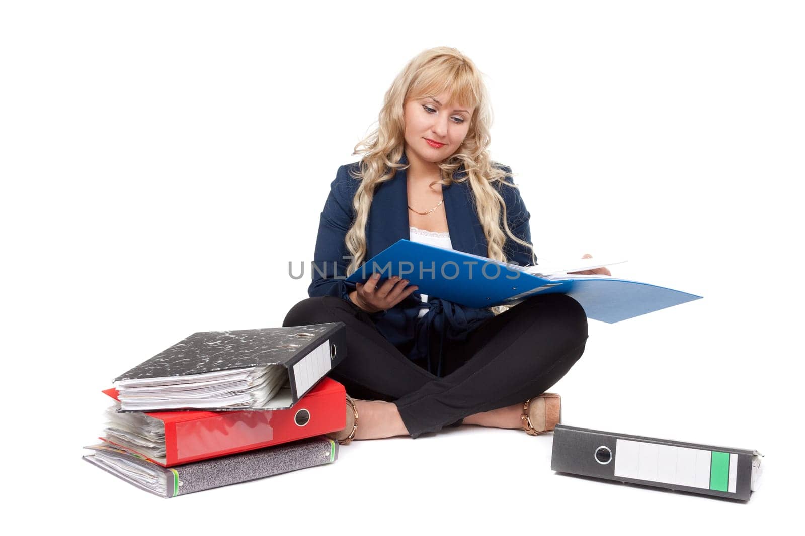 Beautiful girl sitting on the floor with folders for documents. Isolate on white background.