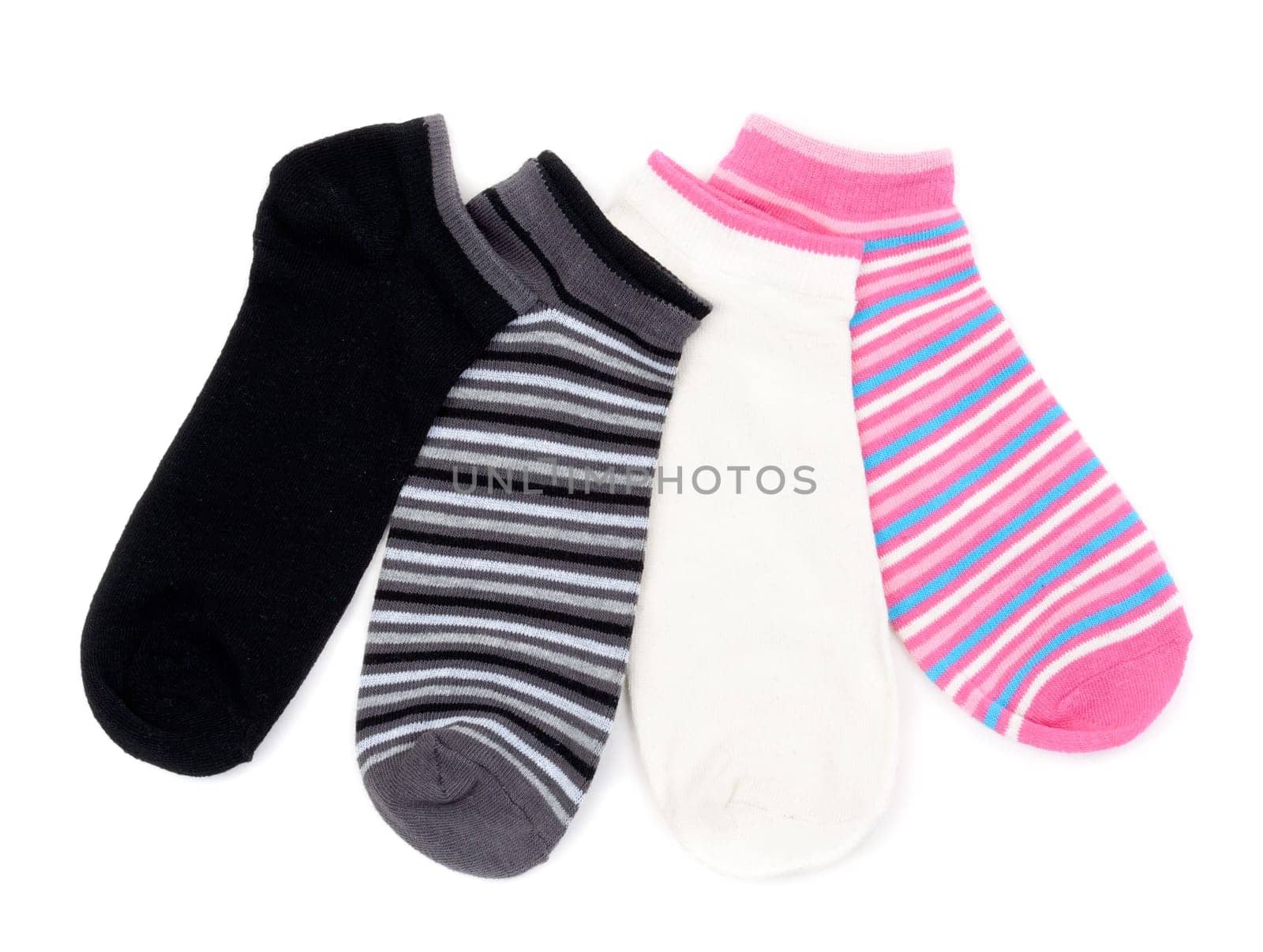 Four colored striped socks isolated on white background