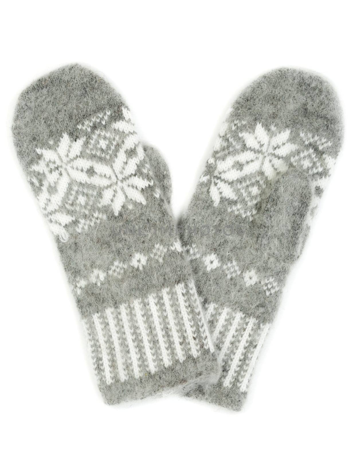 Grey knitted gloves with a pattern of snowflakes isolated on white background